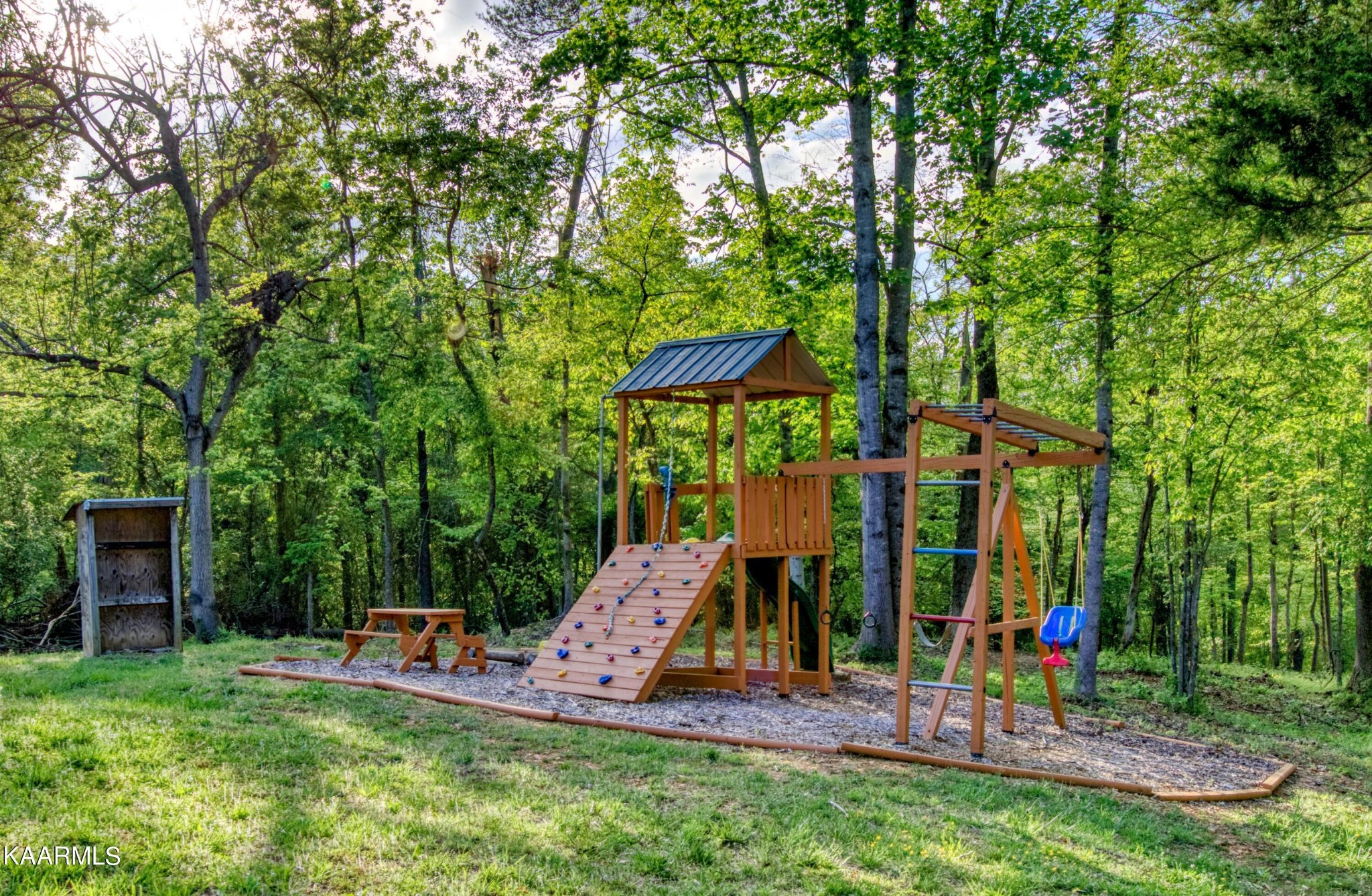 2313 Tooles Bend Road Knoxville, TN 37922 - Photo 7 of 50 a view of a backyard with a table and chairs