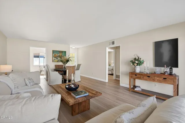 a table with a vase and flowers on it