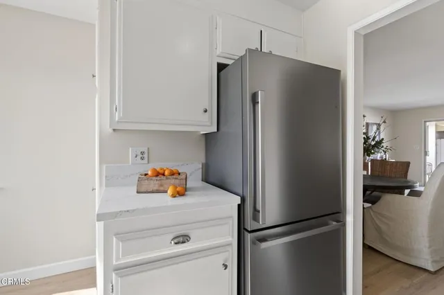 a view of a bedroom with a window and front door