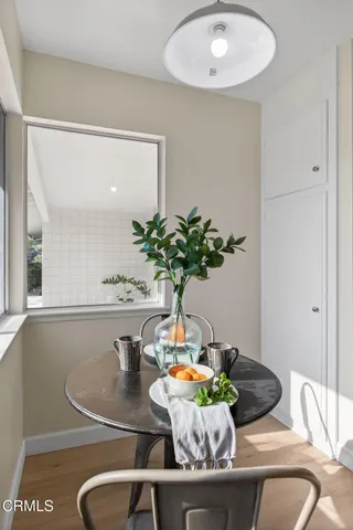 a bathroom with a granite countertop sink a toilet and a mirror