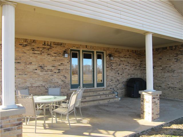 559 Rock Road Morrison, TN 37357 - Photo 3 of 20 Covered patio in back yard. The yard is fenced in.