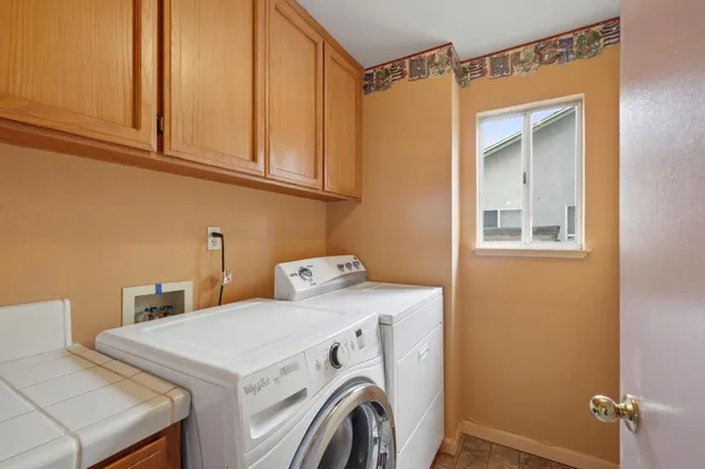a utility room with dryer and washer