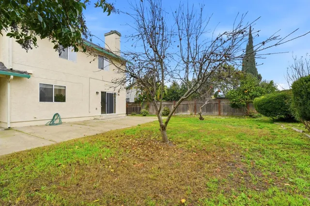 a backyard of a house with lots of green space