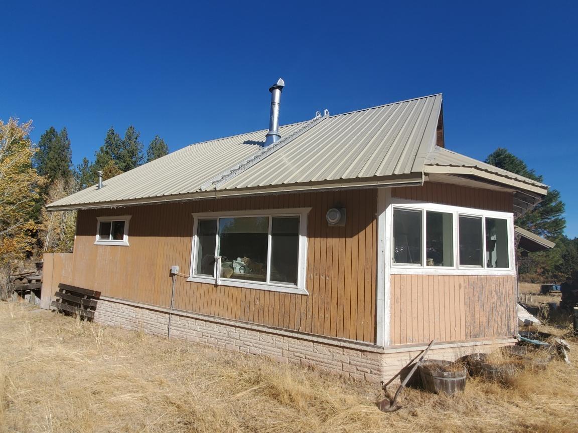 23655 Bliss Road Sprague River, OR 97639 - Photo 1 of 8 a front view of a house with a yard