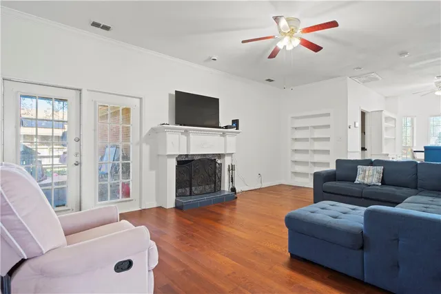 a kitchen with a refrigerator a stove a sink dishwasher with a dining table and chairs