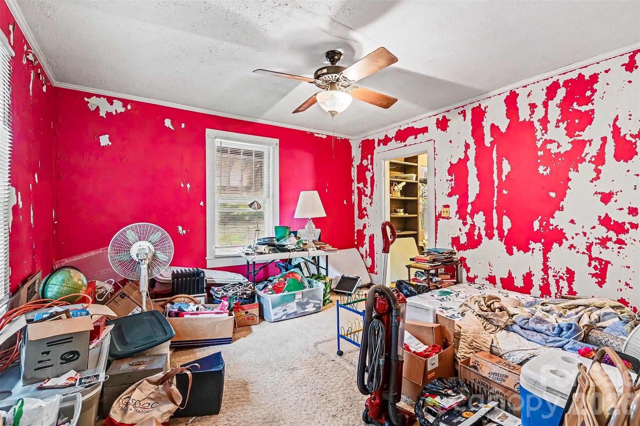 1116 Medlin Road Monroe, NC 28112 - Photo 23 of 40 a bedroom with furniture and a chandelier