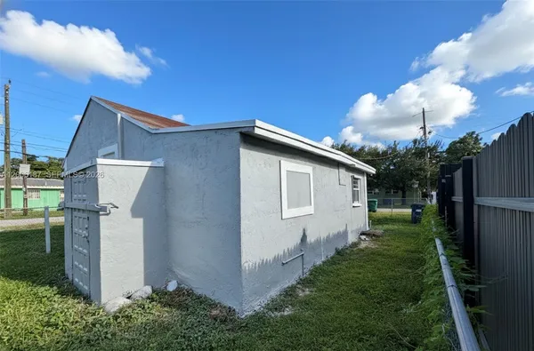 a house view with a backyard space