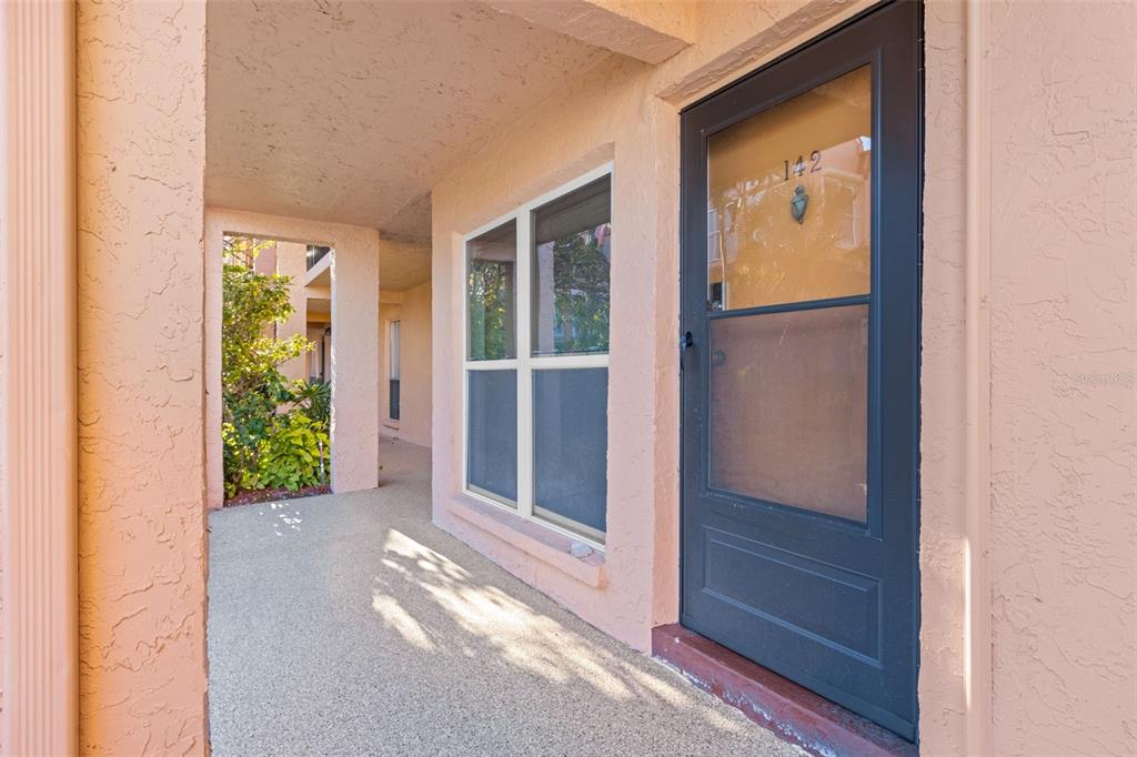 8921 Blind Pass Road, Unit 142 St. Pete Beach, FL 33706 - Photo 6 of 22 a view of outdoor space and balcony