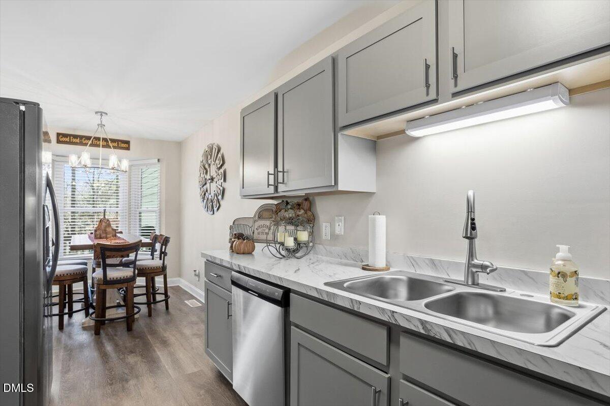 605 Oak Run Drive Raleigh, NC 27606 - Photo 15 of 28 a kitchen with sink and cabinets