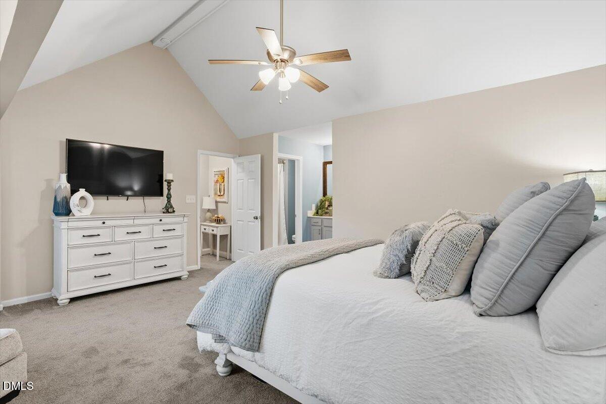 605 Oak Run Drive Raleigh, NC 27606 - Photo 19 of 28 a bedroom with a bed and a flat screen tv