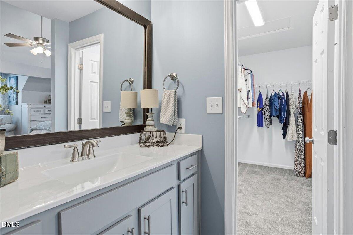 605 Oak Run Drive Raleigh, NC 27606 - Photo 23 of 28 a bathroom with a sink and a mirror