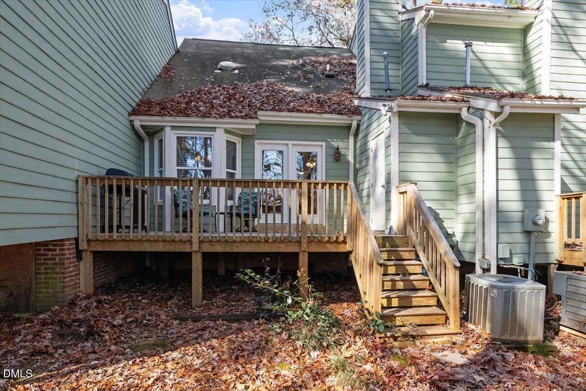 605 Oak Run Drive Raleigh, NC 27606 - Photo 24 of 28 a view of a house with a yard and deck