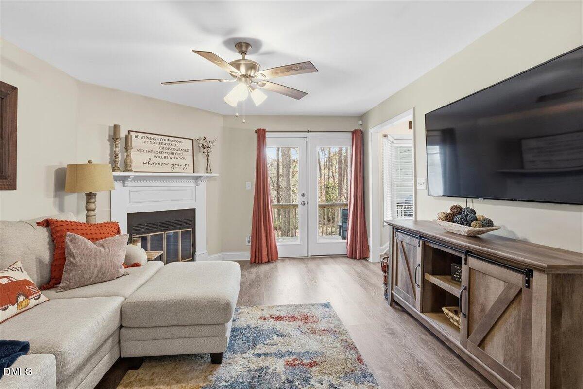 605 Oak Run Drive Raleigh, NC 27606 - Photo 3 of 28 a living room with furniture and a fireplace