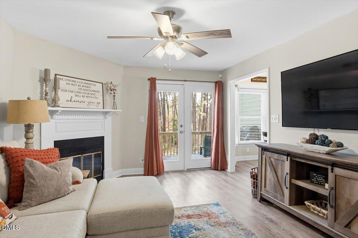 605 Oak Run Drive Raleigh, NC 27606 - Photo 6 of 28 a living room with furniture and a fireplace