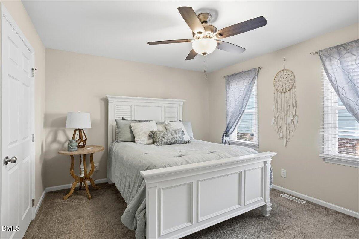 605 Oak Run Drive Raleigh, NC 27606 - Photo 9 of 28 a bed room with a bed and a window