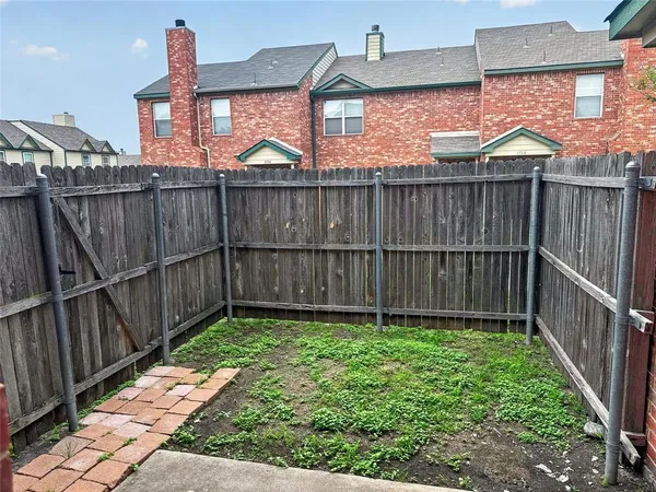 a view of a backyard with a trees