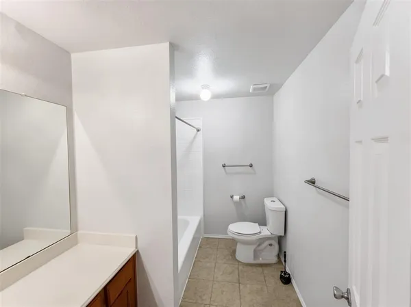 a bathroom with a toilet a sink and a shower