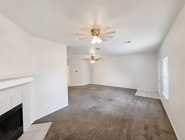 a view of a chandelier fan in a room