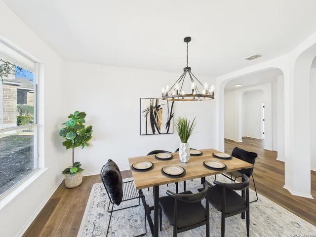 a view of a dining room with furniture window and wooden floor