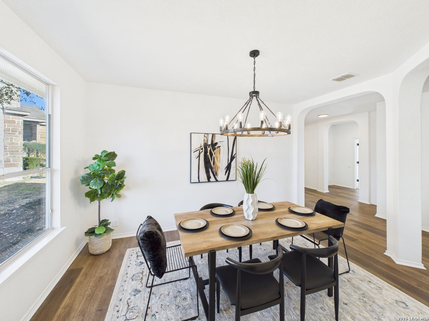 7202 Sandy Bay Converse, TX 78109 - Photo 11 of 40 a view of a dining room with furniture window and wooden floor