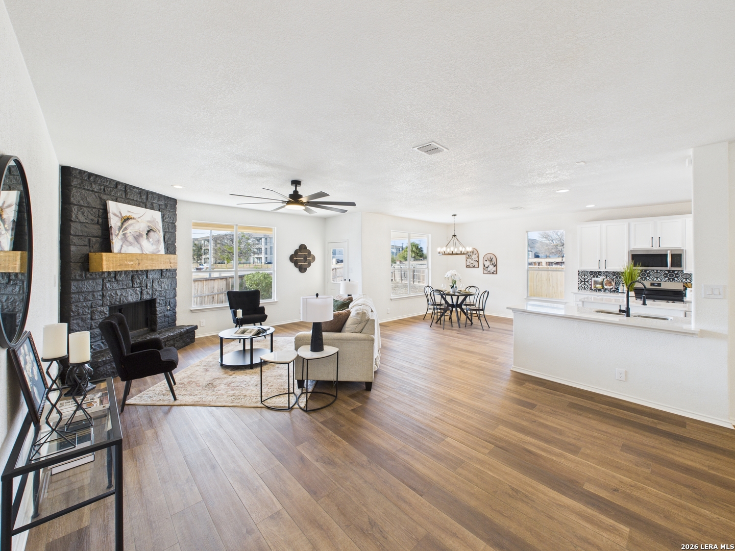 7202 Sandy Bay Converse, TX 78109 - Photo 13 of 40 a living room with fireplace furniture and a wooden floor