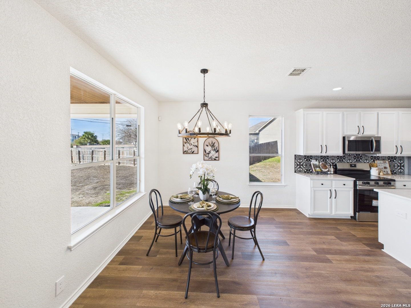 7202 Sandy Bay Converse, TX 78109 - Photo 16 of 40 a view of a dining room with furniture window and wooden floor