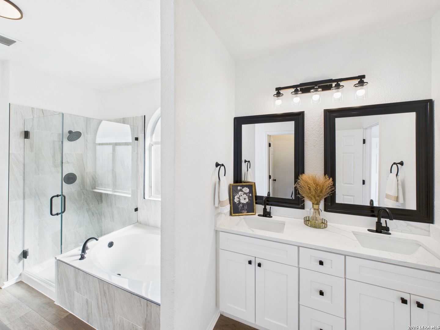 7202 Sandy Bay Converse, TX 78109 - Photo 24 of 40 a bathroom with a double vanity sink mirror and bathtub