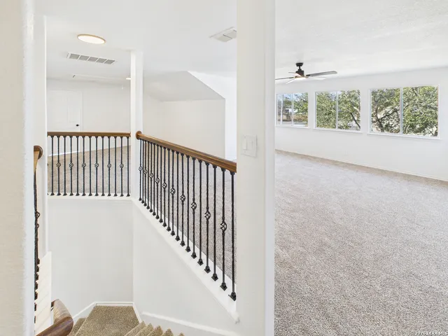 a view of a hallway with windows