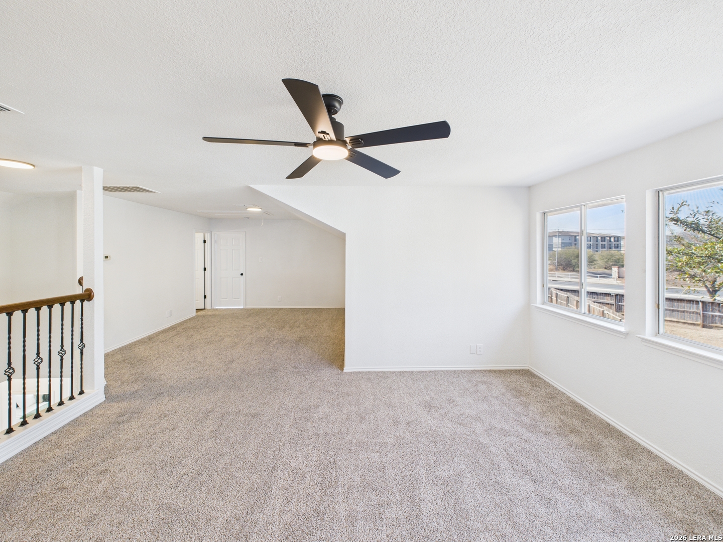 7202 Sandy Bay Converse, TX 78109 - Photo 28 of 40 a view of a livingroom with a ceiling fan & window