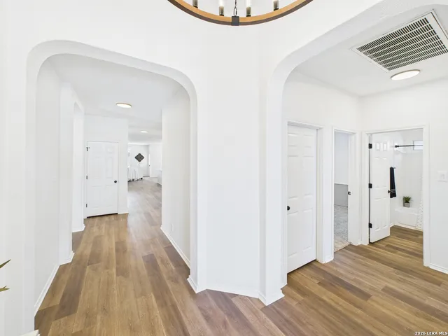 a view of a bathroom with a sink and a mirror