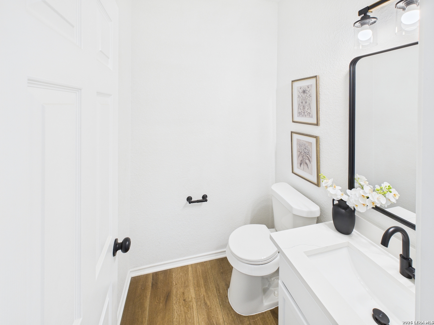 7202 Sandy Bay Converse, TX 78109 - Photo 9 of 40 a bathroom with a sink and a toilet