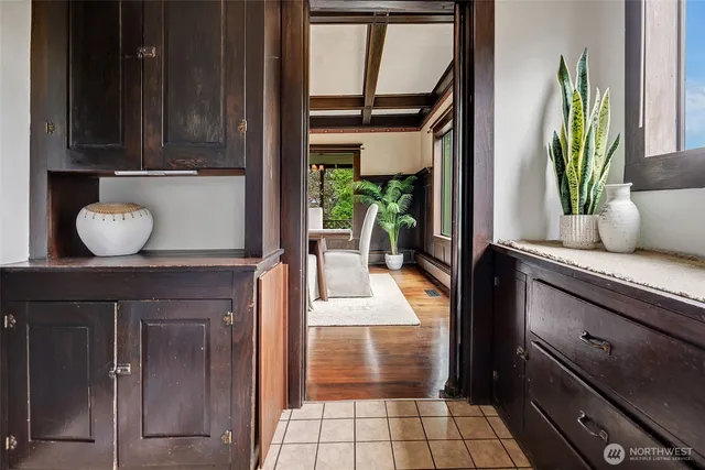 a kitchen with a stove a refrigerator and a sink
