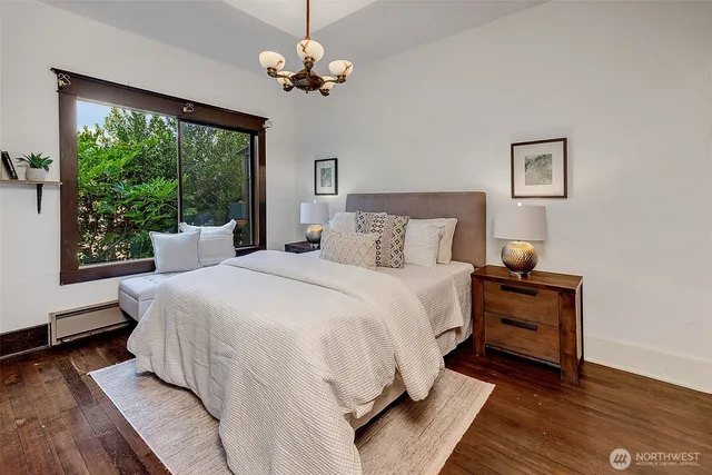 a bed room with a bed and a chair