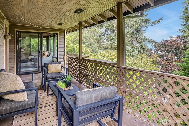 a outdoor dining space with a table and a chairs