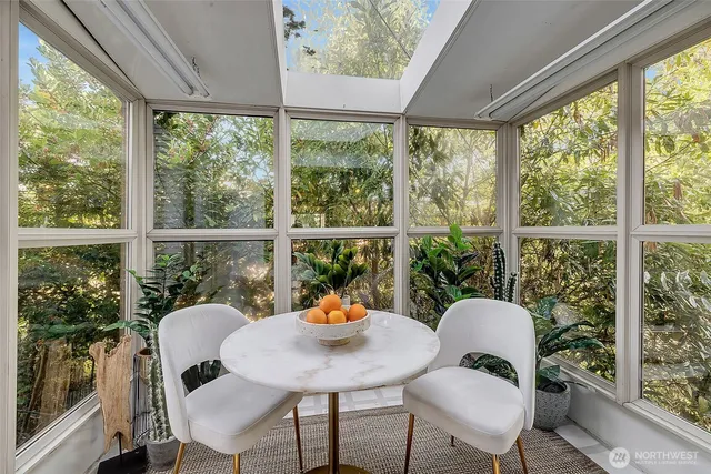 a view of a dining room with furniture window and outside view