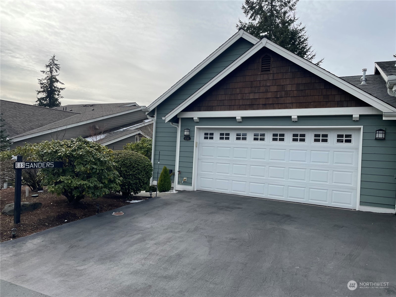 a large tree in front of a house