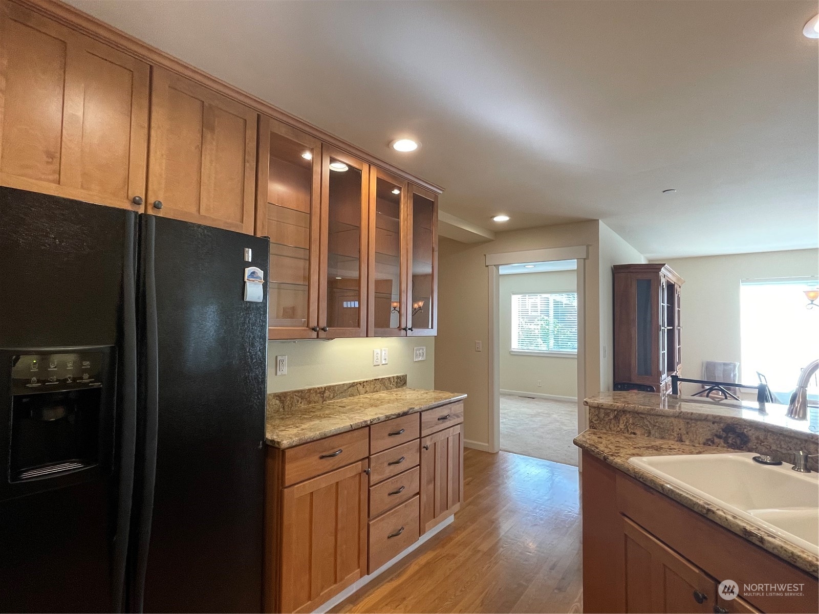 160 East Soderberg Road, Unit E15 Allyn, WA 98524 - Photo 14 of 33 a kitchen with stainless steel appliances granite countertop a refrigerator a sink and a stove