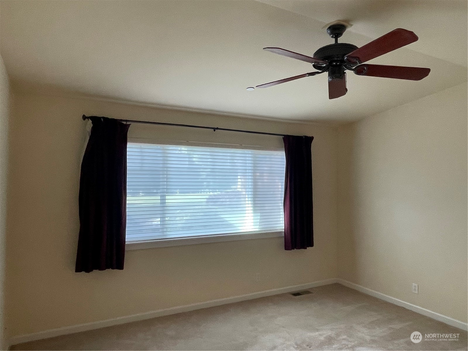 160 East Soderberg Road, Unit E15 Allyn, WA 98524 - Photo 17 of 33 a view of empty room with windows and fan