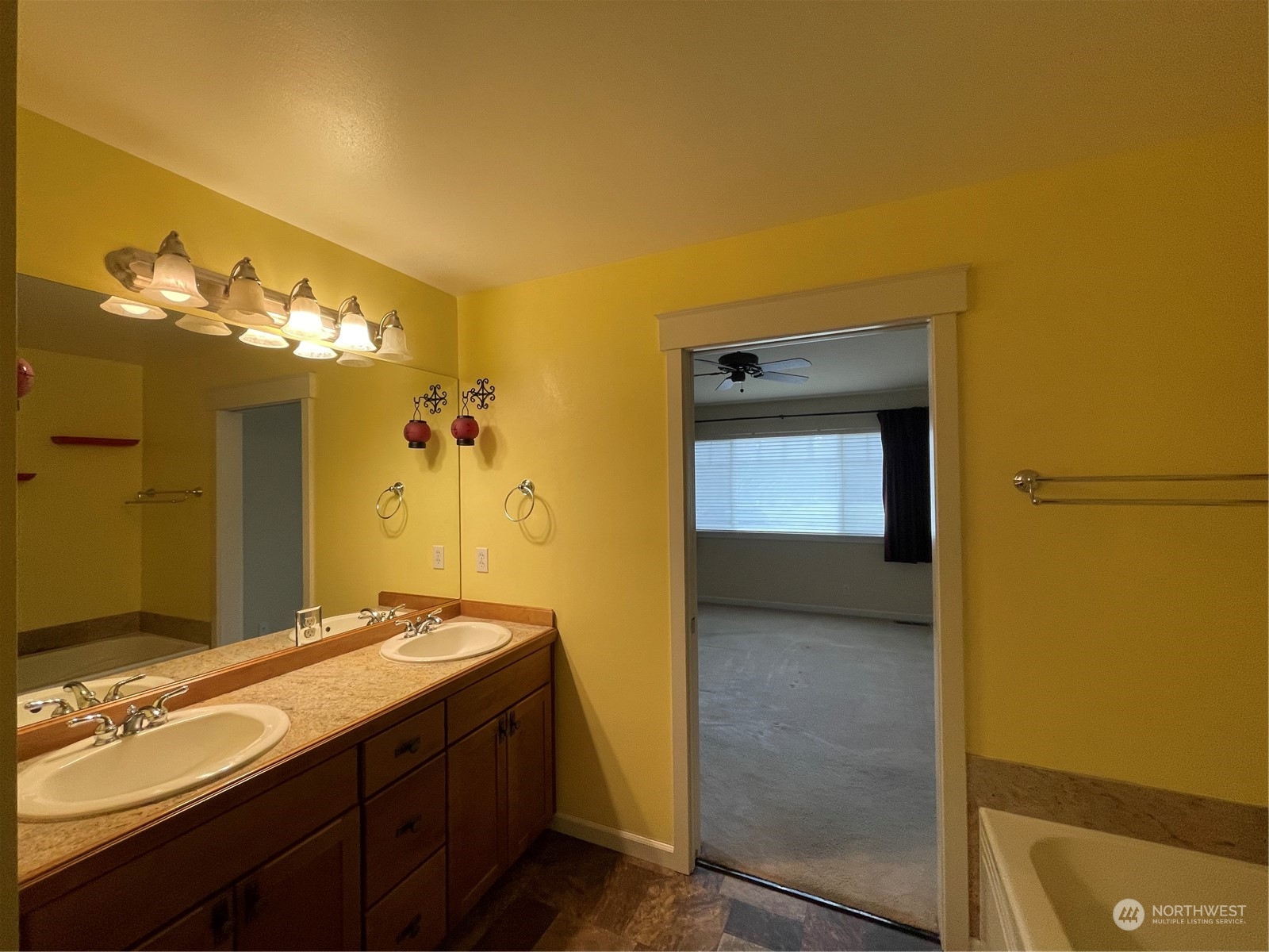 160 East Soderberg Road, Unit E15 Allyn, WA 98524 - Photo 20 of 33 a bathroom with a granite countertop sink a mirror and a shower