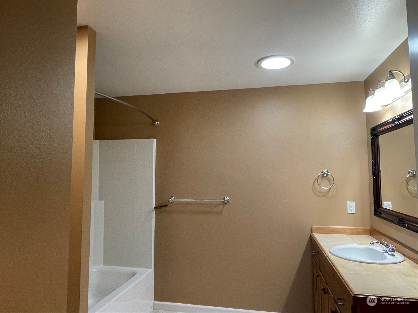 160 East Soderberg Road, Unit E15 Allyn, WA 98524 - Photo 28 of 33 a bathroom with a sink a mirror and a toilet