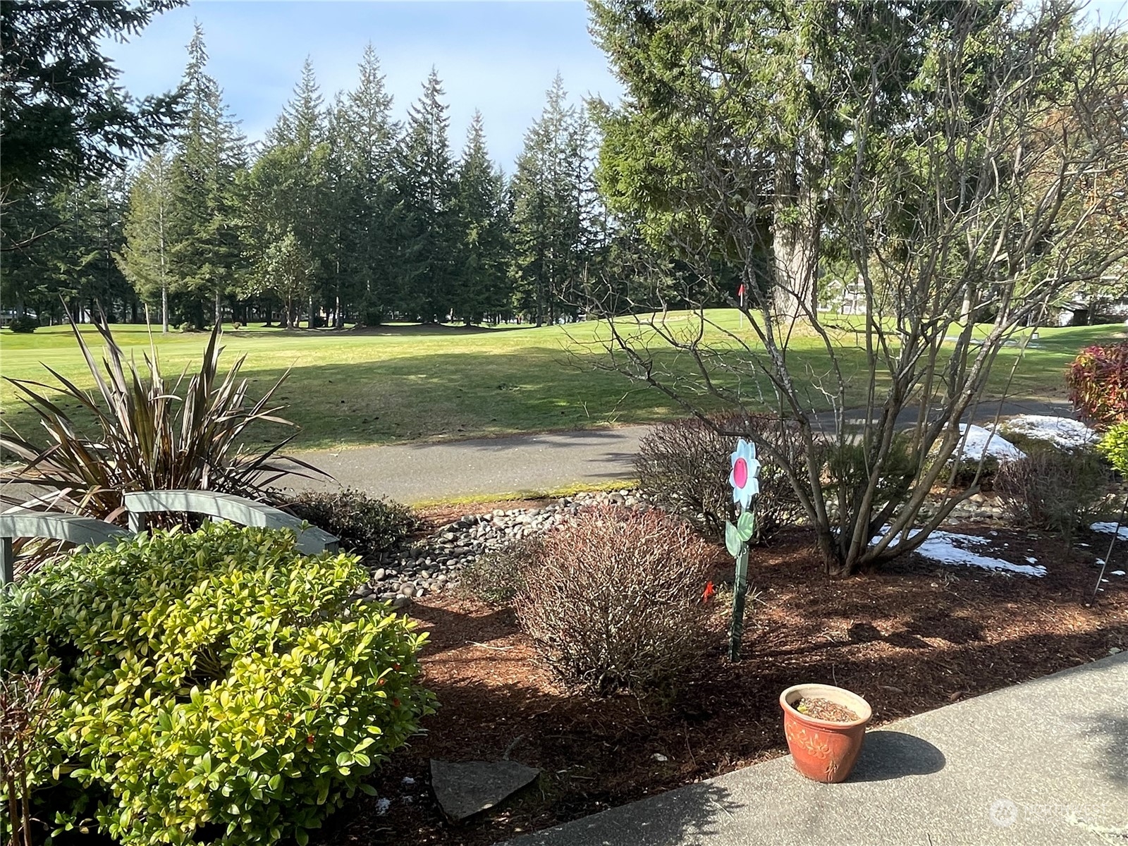160 East Soderberg Road, Unit E15 Allyn, WA 98524 - Photo 3 of 33 a view of a wooden floor with a yard