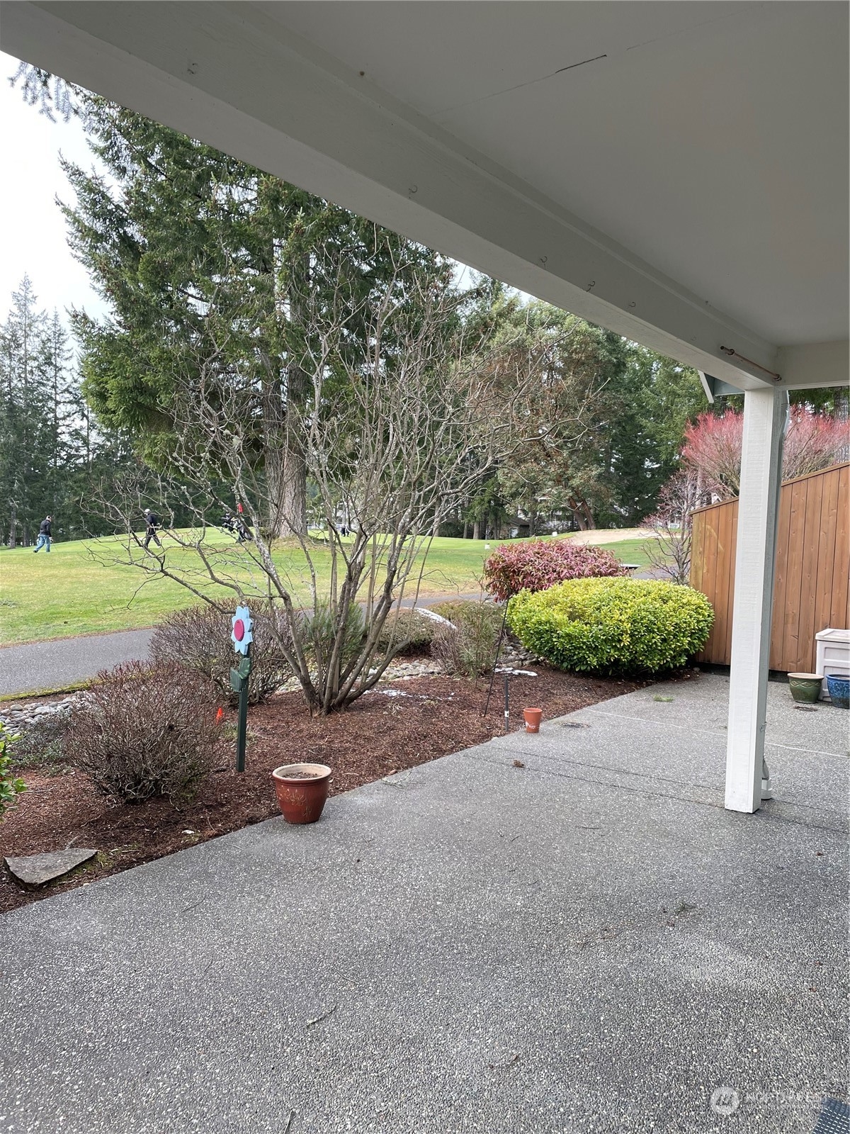 160 East Soderberg Road, Unit E15 Allyn, WA 98524 - Photo 31 of 33 a view of a road with porch and outdoor space