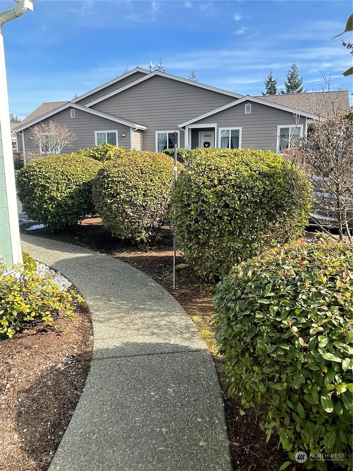 160 East Soderberg Road, Unit E15 Allyn, WA 98524 - Photo 5 of 33 front view of a house