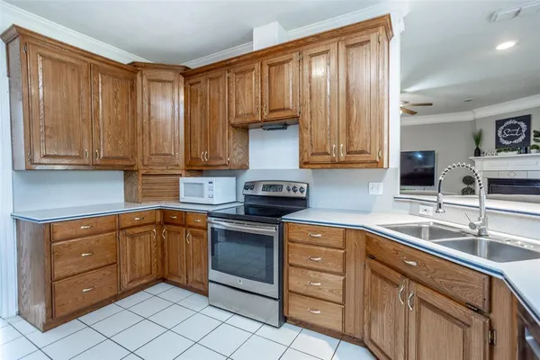 a kitchen with stainless steel appliances granite countertop a sink and cabinets