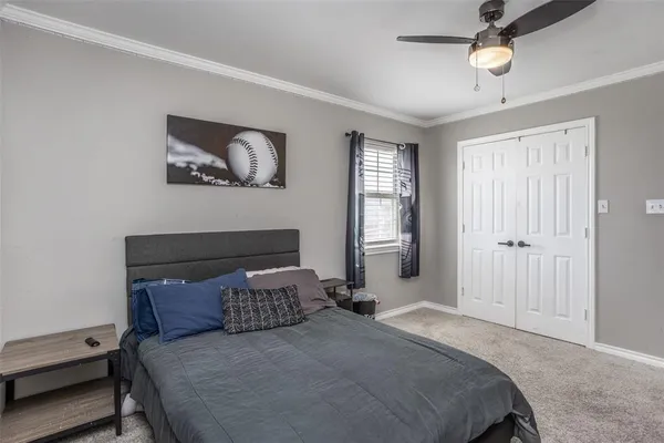 a bedroom with a bed and window