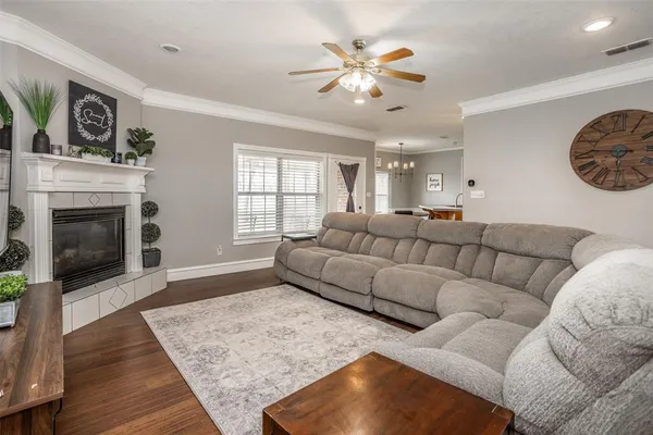 a living room with furniture and a fireplace