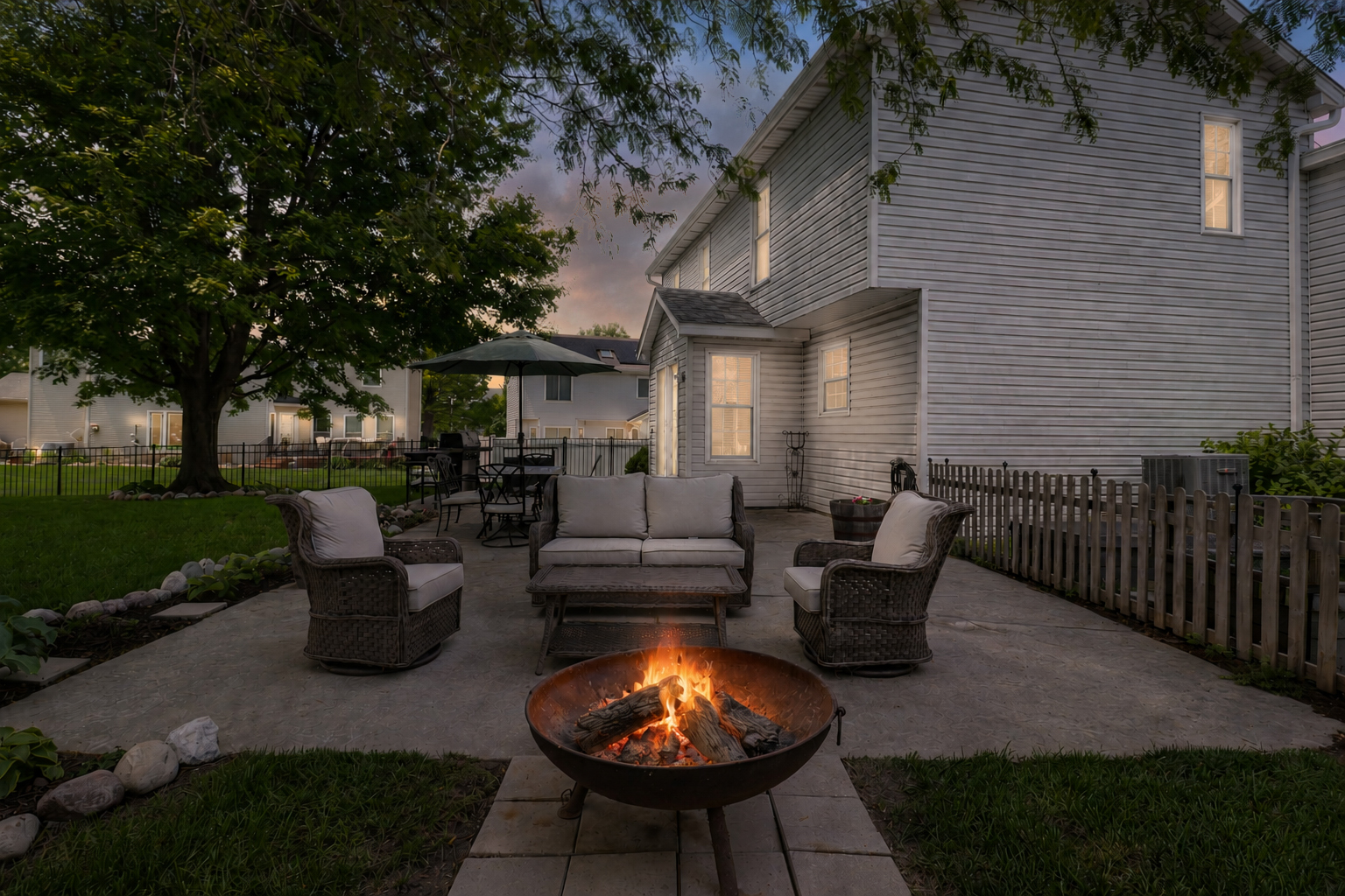 3203 Eagle Crest Road Bloomington, IL 61704 - Photo 50 of 52 a backyard of a house with fountain table and chairs