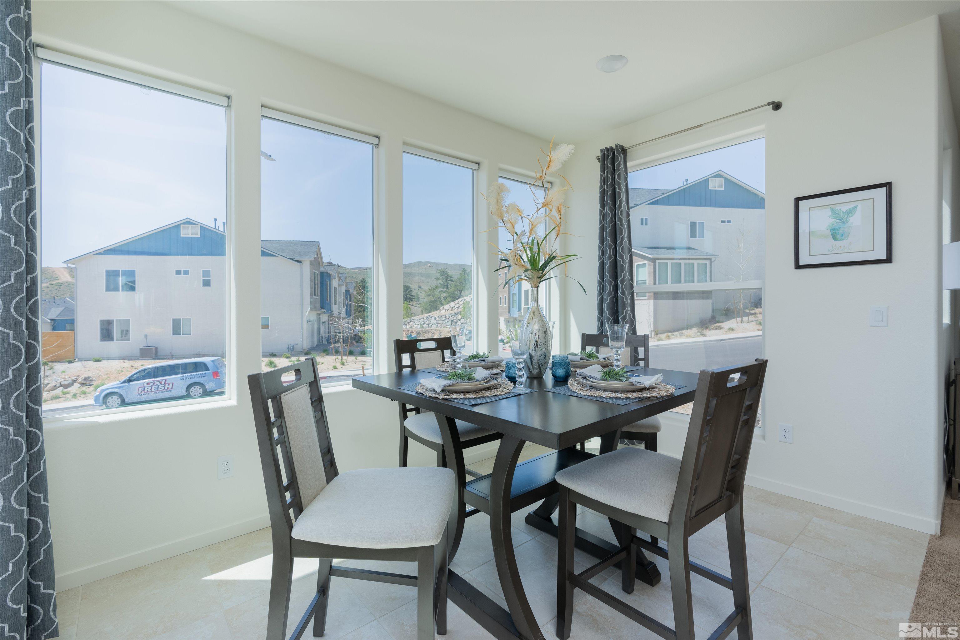 565 Gloria May Lane Reno, NV 89503 - Photo 8 of 29 a view of a dining room with furniture and window