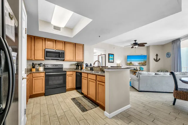 a kitchen with cabinets and appliances
