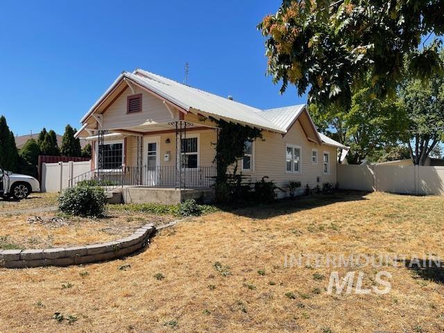 1228 6th Street Clarkston, WA 99403 - Photo 1 of 1 Bungalow featuring a porch and a metal roof